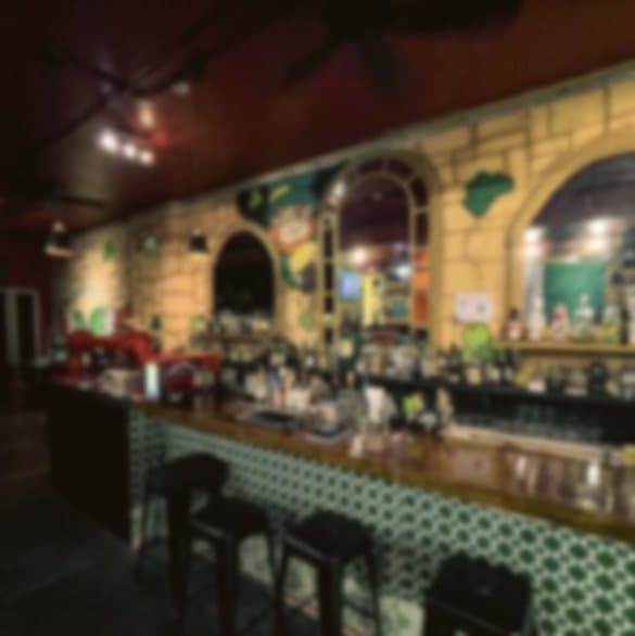 The dark timber bar at Murphy's on a busy night